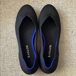 Rothy's The Flat Round Toe with Blue Trim Size 9
Like New